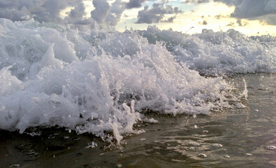 braking waves on the beach 