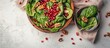 A top view of a wooden bowl filled with fresh spinach leaves, crunchy walnuts, and vibrant pomegranate seeds, creating a colorful and nutritious salad.