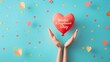 Hands Releasing Heart Balloon for World Compliment Day