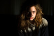 © GT77 - Dramatic portrait of young woman, stark contrast in lighting creates mood of introspection internal conflict., complexity of emotion. Search for Identity or understanding oneself, mental health issues