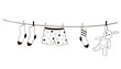 clothes and toys are dried on a line after washing