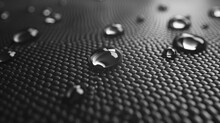 3D Illustration Of Water Droplets On A Carbon Fabric Surface