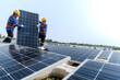 © ultramansk - Male workers repair Floating solar panels on water lake. Engineers construct on site Floating solar panels at sun light. clean energy for future living. Industrial Renewable energy of green power.