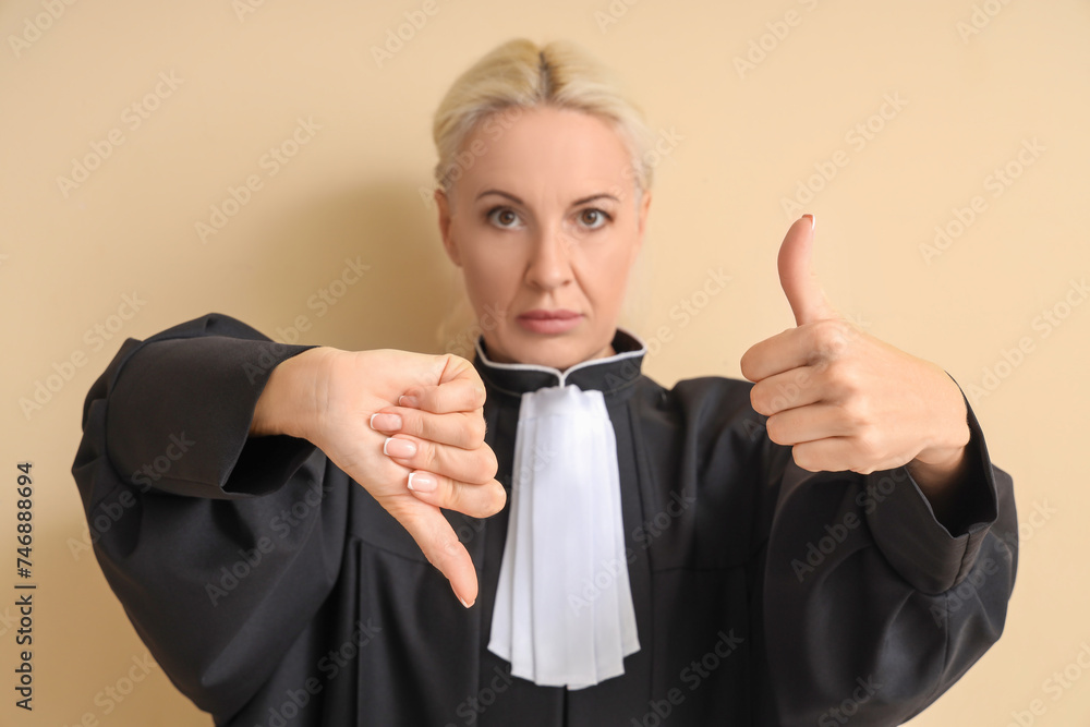 Mature judge showing like and dislike on beige background