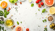 Assorted fresh vegetables, fruits, and condiments layout on white background. Flat lay composition with copy space for design and print, healthy eating and cooking concept
