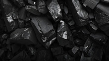 Picture Of A Pile Of Charcoal That Uses Mainly Black Tones