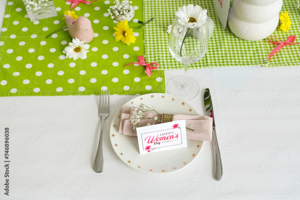 Simple table setting with flowers for International Women's Day celebration