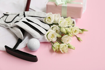 Wall Mural - Composition with golf club, glove and beautiful flowers on pink background, closeup. International Women's Day