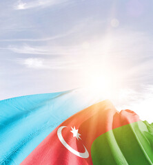 Wall Mural - Azerbaijan flag in waving in beautiful sky with sunlight.