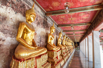 Sticker - Row of gilded Buddha statues in Wat Suthat Thepwararam, Bangkok