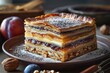 traditional Hungarian Jewish pastry, filled with layers of apple puree, layers of walnuts, layers of extreme amount of poppy seeds, and plum jam, cut into rectangles