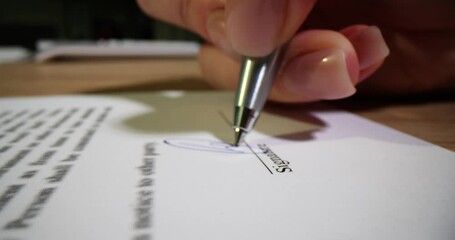 Wall Mural - Business woman hands signing a business agreement