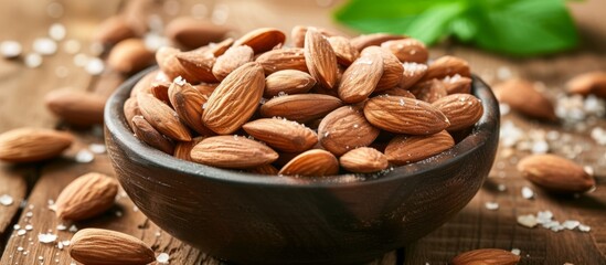 Wall Mural - Fresh Almonds in a Rustic Bowl on a Wooden Table - Healthy Snack Concept