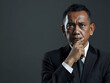 © DS Showcase - A mature Indonesian CEO is thinking hard to find a solution for his business