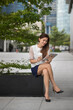 © Image Smith - Asian business woman using a digital tablet.
