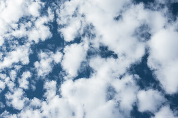view to the sky with lot of white clouds on deep blue sky