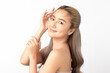 © Shutter B - Happy beautiful young asian woman smile touching her face on white background, clean fresh bare skin concept. Facial treatment, Perfect skin, Natural make up.