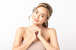 © Shutter B - Happy beautiful young asian woman with hands clasped together smiling gently against Isolated on white background. Clean fresh bare skin concept. Facial treatment, Perfect skin, Natural make up.