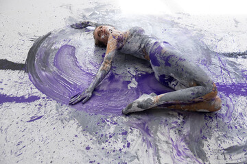 Wall Mural - sexy nude artistically abstract painted woman, ballerina with white, gray and purple paint. Creative bodypainting art