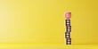 © Smile Studio AP - Dartboard with arrow on the top of ladders step for target and goal concept.