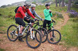 © AW/peopleimages.com - Friends, cyclist and forest with bike together for bonding, exercise and health with adventure in Chicago. Fitness, trail and mountain with hobby for mindset in nature, trip and wellness for fun.