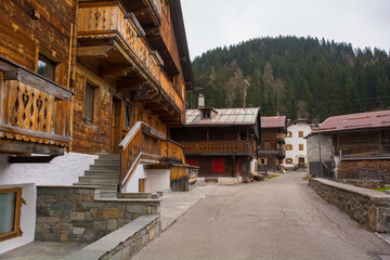 Wall Mural - Traditional wooden houses in the historic mountain village of Cima Sappada in Carnia in Udine Province, Friuli-Venezia Giulia, north east Italy