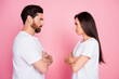 © deagreez - Photo portrait of attractive young couple look each other crossed hands quarrel wear trendy white outfit isolated on pink color background