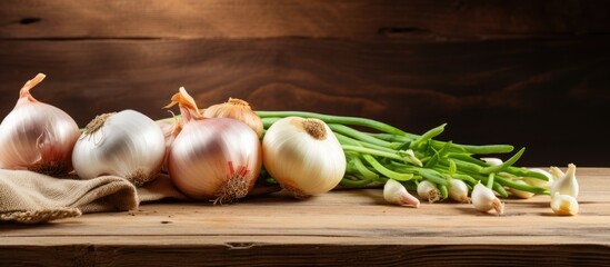 Sticker - A bunch of fresh green beans and white onions are neatly arranged on a rustic wooden table. The vegetables are visually appealing and ready for cooking or snacking.