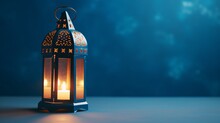An Illuminated Arabic Lantern On Blue Background