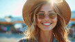 Beautiful young woman wearing sunglasses and round hat
