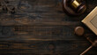 Wooden gavel, judges hammer or mallet on books over wood table background, law, legal or court symbol or concept, top view flat lay from above.