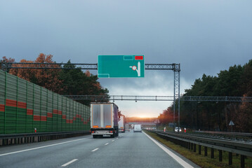 Wall Mural - Truck driver seat view. Cockpit view from the car. European autobahn and vehicles in motion.	