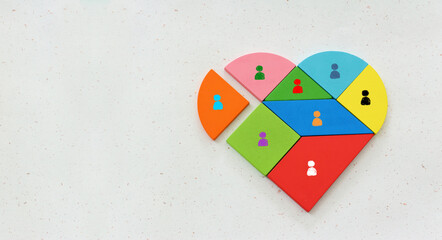 Wall Mural - Heart shape puzzle with figures. Concept of teamwork and friendship