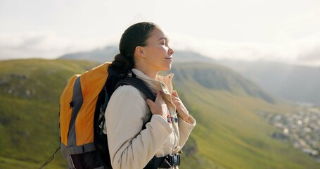 Wall Mural - young woman, trekking on mountains and breathing fresh air for outdoor wellness, fitness and health.
