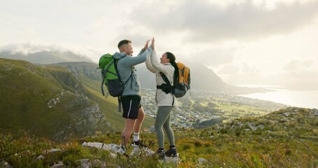Wall Mural - couple, high five and hiking on mountains for success, support and travel achievement or goals in na