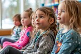 Fototapeta  - Group of Preschool Children Sitting Together with Attention During Story Time at Library