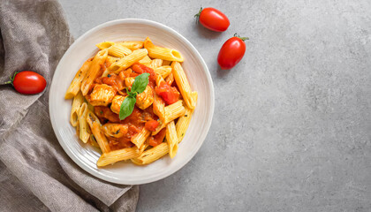 Canvas Print - penne pasta. top view of Penne pasta in tomato sauce on white plate with copy space