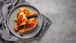 © Chidori_studio - Grilled chicken Leg, bbq chicken legs. top view of grilled chicken legs on grey dish, copy space