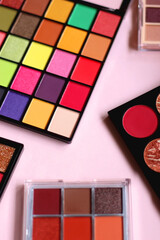 Canvas Print - Various colorful eyeshadow palettes on bright pink background. Selective focus.