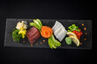 Sashimi - Assorted sliced raw fish  (salmon fillet, tuna fillet, cod fillet) seen from above