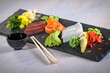 Sashimi, a Japanese delicacy consisting of fresh raw fish  (salmon fillet, tuna fillet, cod fillet)