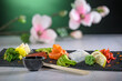 Sashimi, a Japanese delicacy  with salmon , tuna, cod with flower in the background