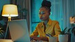 © Moon Guy - Black business woman doing work at laptop