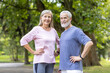 © Liubomir - Active senior couple enjoying fitness together in a lush green park