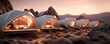 Futuristic glamping tents with bis glass windows in rocky desert or mountains