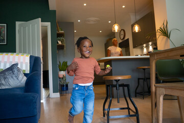 Canvas Print - Girl (2-3) running across living room