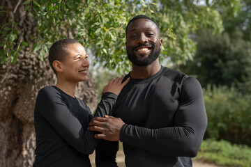 Sticker - Portrait of smiling athletic couple in park