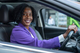 Fototapeta Londyn - Portrait of smiling woman driving car