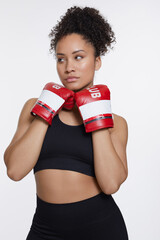 Canvas Print - Studio portrait of athletic woman in with boxing gloves