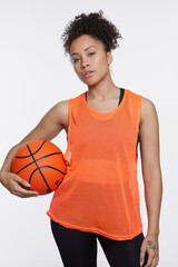 Canvas Print - Studio portrait of athletic woman with basketball ball